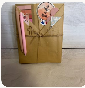 Wrapped mystery book with bookish accessories