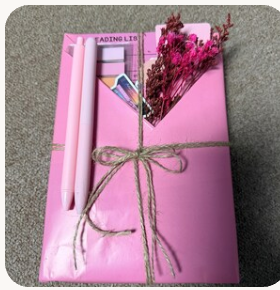 Pink wrapped mystery book gift